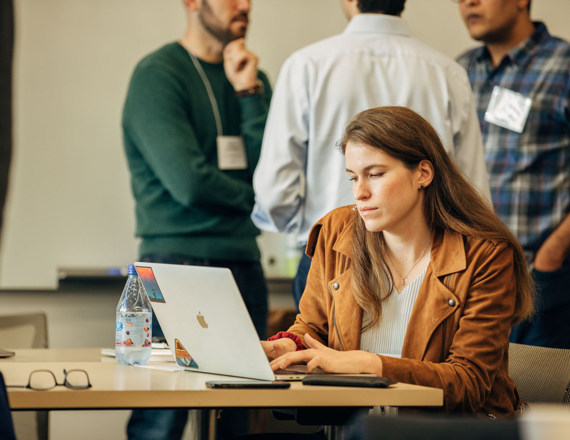Shannon Axelord, Senior Software Engineer at the Chan Zuckerberg Initiative looks at a Imaging data on her laptop.