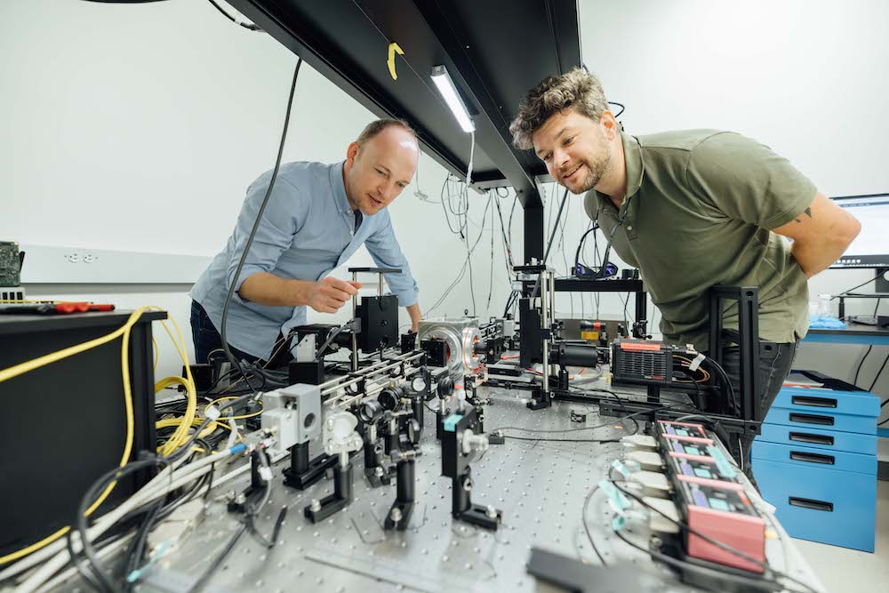 CZ Biohub SF scientists Loïc Royer and Merlin Lange work on a light-sheet microscope